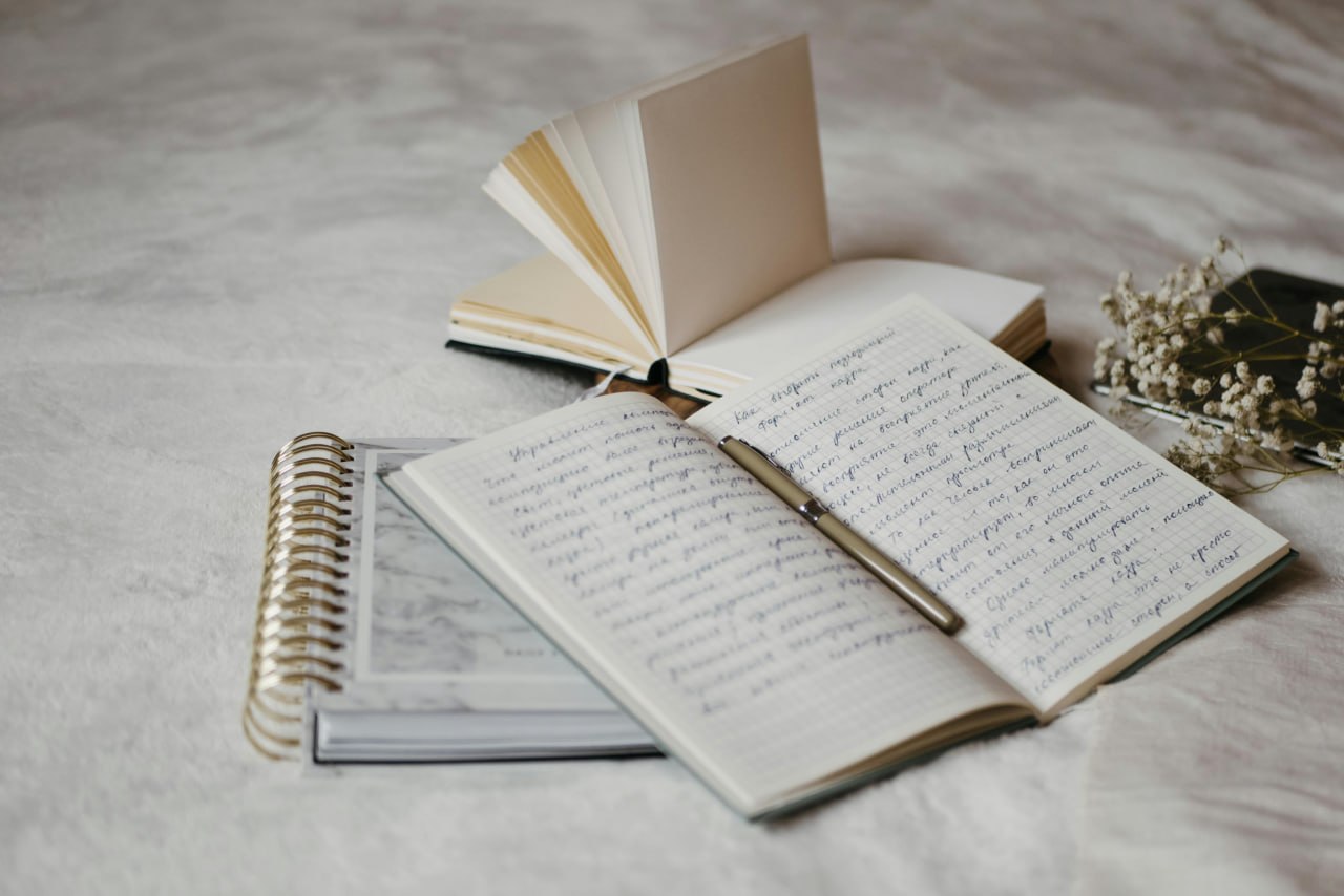 Handwritten symptom and food notes prepared for a gastroenterologist visit